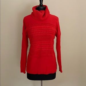 Red Sweater with high neck.